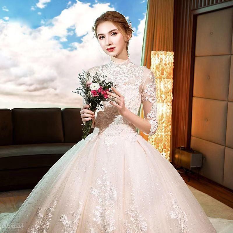 فستان زفاف شفاف من أعلى يحتوى على أشكال وروسومات جميلة نوعية ممتازة 